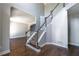 Elegant staircase with hardwood floors, modern banisters, and abundant natural light at 2025 Fairway Crossing Dr, Woodstock, GA 30188