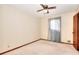 Bedroom featuring neutral walls, ceiling fan, carpet, and window with curtains offering plenty of natural light at 1420 Stephenson Rd, Lithonia, GA 30058