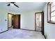 Bright bedroom featuring neutral walls, carpet, and ensuite bathroom at 1420 Stephenson Rd, Lithonia, GA 30058