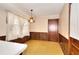 Traditional dining area with wood paneling, yellow carpet and natural light at 1420 Stephenson Rd, Lithonia, GA 30058