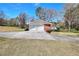 Two car detached garage with concrete drive on a well maintained lawn at 1420 Stephenson Rd, Lithonia, GA 30058