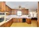 Classic kitchen with wood cabinets, white countertops, and vintage appliances at 1420 Stephenson Rd, Lithonia, GA 30058