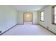 Bright living room with neutral walls, classic wood trim, and ample natural light at 1420 Stephenson Rd, Lithonia, GA 30058