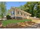 Exterior of a house with a stone foundation and freshly cut grass at 1615 Orlando Sw St, Atlanta, GA 30311