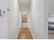 Hallway featuring hardwood floors and access to the bathroom and kitchen at 1615 Orlando Sw St, Atlanta, GA 30311