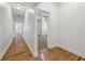 Hallway featuring hardwood floors and access to various rooms at 1615 Orlando Sw St, Atlanta, GA 30311