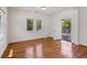 Bright living room featuring hardwood floors and access to an outdoor deck at 1615 Orlando Sw St, Atlanta, GA 30311