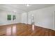 Bright living room featuring hardwood floors, white walls, and ample natural light from the windows at 1615 Orlando Sw St, Atlanta, GA 30311