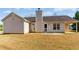 Backyard with a patio and siding on the house at 1715 Eden Valley Ct, Loganville, GA 30052