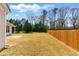 Large, fenced backyard offers ample space for outdoor activities and entertaining at 1715 Eden Valley Ct, Loganville, GA 30052
