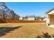 Large backyard with a wooden fence at 1715 Eden Valley Ct, Loganville, GA 30052