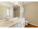 Bright bathroom features double sink vanity and large mirror at 1715 Eden Valley Ct, Loganville, GA 30052