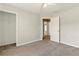 Neutral bedroom featuring carpet flooring, closet, and neutral paint palette at 1715 Eden Valley Ct, Loganville, GA 30052