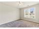 Bright bedroom with neutral carpet and natural light at 1715 Eden Valley Ct, Loganville, GA 30052