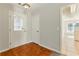 Entryway with neutral walls, decorative front door, closet, and tile flooring leading into carpeted rooms at 1715 Eden Valley Ct, Loganville, GA 30052