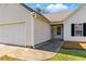 Close-up of single Gathering home featuring a two-car garage, siding, and window with shutters at 1715 Eden Valley Ct, Loganville, GA 30052