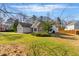 Charming single-story home with stone accents, manicured lawn, and an attached garage at 1715 Eden Valley Ct, Loganville, GA 30052