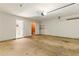 Spacious garage with concrete floor and white walls at 1715 Eden Valley Ct, Loganville, GA 30052