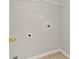 Laundry room has washer and dryer hookups, white shelving, with tile flooring at 1715 Eden Valley Ct, Loganville, GA 30052