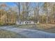 Single-story home with a storage shed in a spacious yard and an access road at 355 Double D Rd, Temple, GA 30179