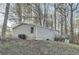 Single story home featuring traditional siding, a wooden porch and is surrounded by mature trees at 355 Double D Rd, Temple, GA 30179