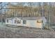 Single story home featuring a star on the front, surrounded by trees and an ample front yard at 355 Double D Rd, Temple, GA 30179