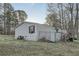 A view of the side of the house with a fenced in area at 355 Double D Rd, Temple, GA 30179