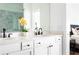 Beautiful bathroom featuring dual sinks, white cabinets, quartz counters and a glass enclosed shower at 6701 Prelude Dr, Atlanta, GA 30328