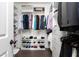 Spacious walk-in closet providing ample storage with custom shelving and hanging racks at 6701 Prelude Dr, Atlanta, GA 30328