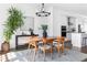 Dining room featuring modern table and chairs, stylish lighting, and ample sunlight at 6701 Prelude Dr, Atlanta, GA 30328