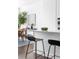 Kitchen island features sleek countertops and modern barstools, perfect for casual dining and entertaining at 6701 Prelude Dr, Atlanta, GA 30328