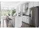 Bright kitchen with stainless steel appliances, white cabinetry, and a center island at 6701 Prelude Dr, Atlanta, GA 30328