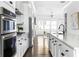 Bright kitchen features long countertops, stainless steel appliances, and an open floor plan leading to living area at 6701 Prelude Dr, Atlanta, GA 30328