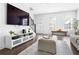 Spacious living room includes a large TV, modern furniture, and ample natural light, great for entertaining at 6701 Prelude Dr, Atlanta, GA 30328