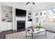 Bright living room featuring fireplace, built-in shelves, and sleek furniture at 6701 Prelude Dr, Atlanta, GA 30328