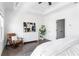 Bright main bedroom featuring a large window, hardwood floors, and modern furniture at 6701 Prelude Dr, Atlanta, GA 30328