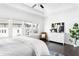 Bright main bedroom with large windows, hardwood floors, and modern furniture at 6701 Prelude Dr, Atlanta, GA 30328