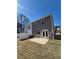 The backyard of a home with a concrete patio and grass at 1180 Cades Walk, Lawrenceville, GA 30045