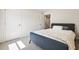 Bedroom features neutral walls, carpet, and a comfortable bed by a window at 1180 Cades Walk, Lawrenceville, GA 30045