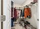 Walk-in closet with lots of storage space including shelves, hanging rods and floor bins at 1180 Cades Walk, Lawrenceville, GA 30045