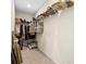 Walk-in closet featuring multiple tiers of shelving for storing clothes, shoes, and accessories at 1180 Cades Walk, Lawrenceville, GA 30045