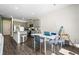 Modern kitchen with granite countertops, stainless steel appliances, and an adjacent dining area at 1180 Cades Walk, Lawrenceville, GA 30045