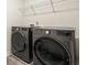Laundry room with modern washer and dryer set at 1180 Cades Walk, Lawrenceville, GA 30045