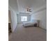 Spacious main bedroom with a tray ceiling, plush carpeting, and a large window at 1180 Cades Walk, Lawrenceville, GA 30045