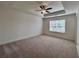 Spacious bedroom with a tray ceiling and a large window for natural light at 1812 Emory Ln # 93, Conyers, GA 30013