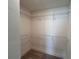 Spacious walk-in closet with wire shelving for optimal storage and organization at 1812 Emory Ln # 93, Conyers, GA 30013