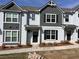 Modern townhome with a painted brick facade and dark accents at 1812 Emory Ln # 93, Conyers, GA 30013