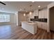 Modern kitchen with a large island, pendant lighting, and stainless steel appliances at 1812 Emory Ln # 93, Conyers, GA 30013