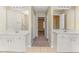 Ensuite bathroom with double sink vanity, walk-in shower, and separate vanities at 2134 Shropshire Se Ln, Atlanta, GA 30316