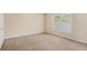 Bright bedroom with natural light streaming through the window, complemented by neutral walls at 2134 Shropshire Se Ln, Atlanta, GA 30316